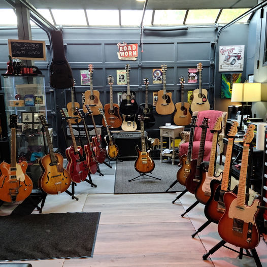 Artist-owned guitars and rare instruments displayed at GuitarGarage showroom